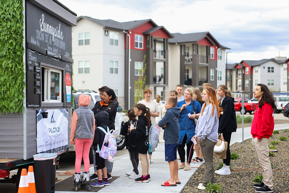 Line of people waiting to order from food truck