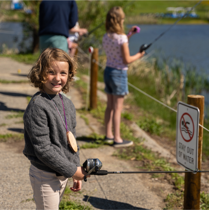 Kids fishing on a river