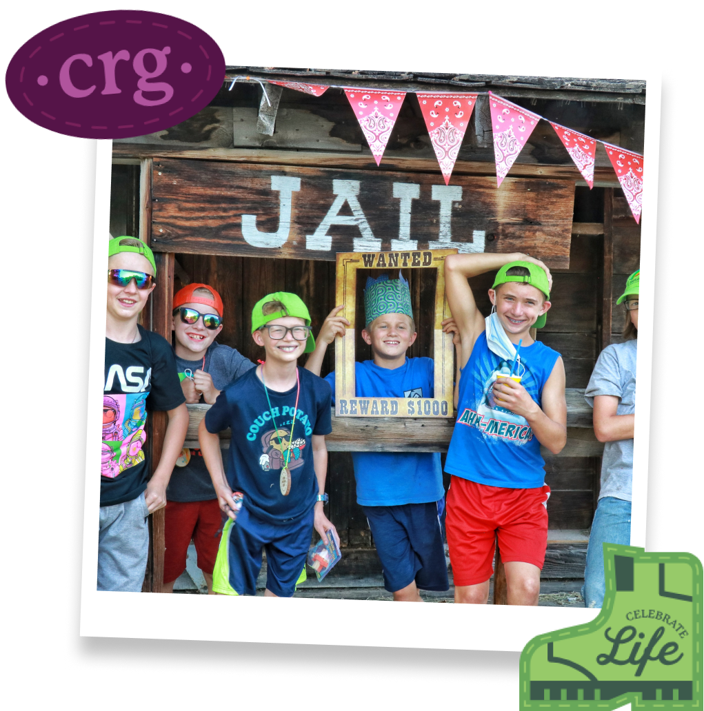 Polaroid of group of kids in front of a mock western jail