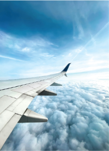 View of airplane wing through passenger window