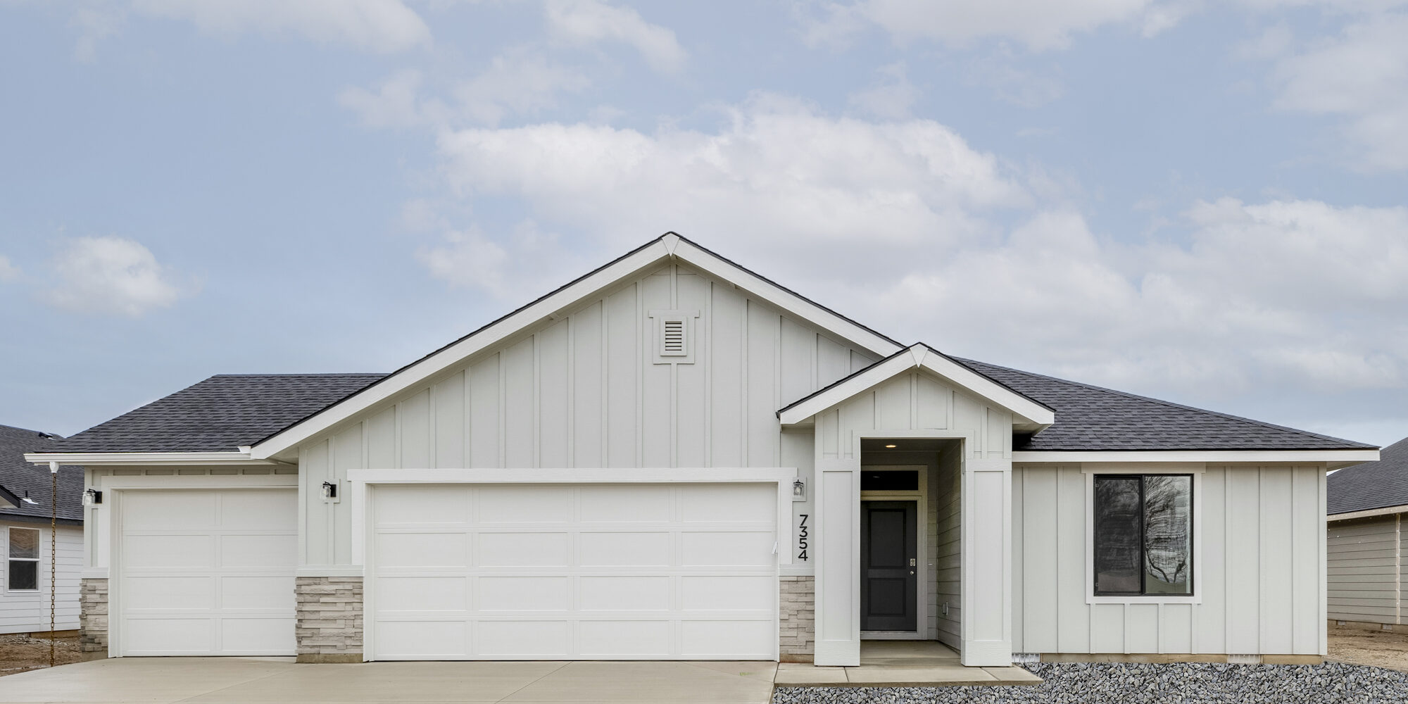 New CBH Homes build showcasing modern farmhouse design with durable board and batten siding, a spacious three-car garage, and a welcoming covered entry. This stylish and functional home is part of a vibrant CBH community, designed for comfort and efficiency.