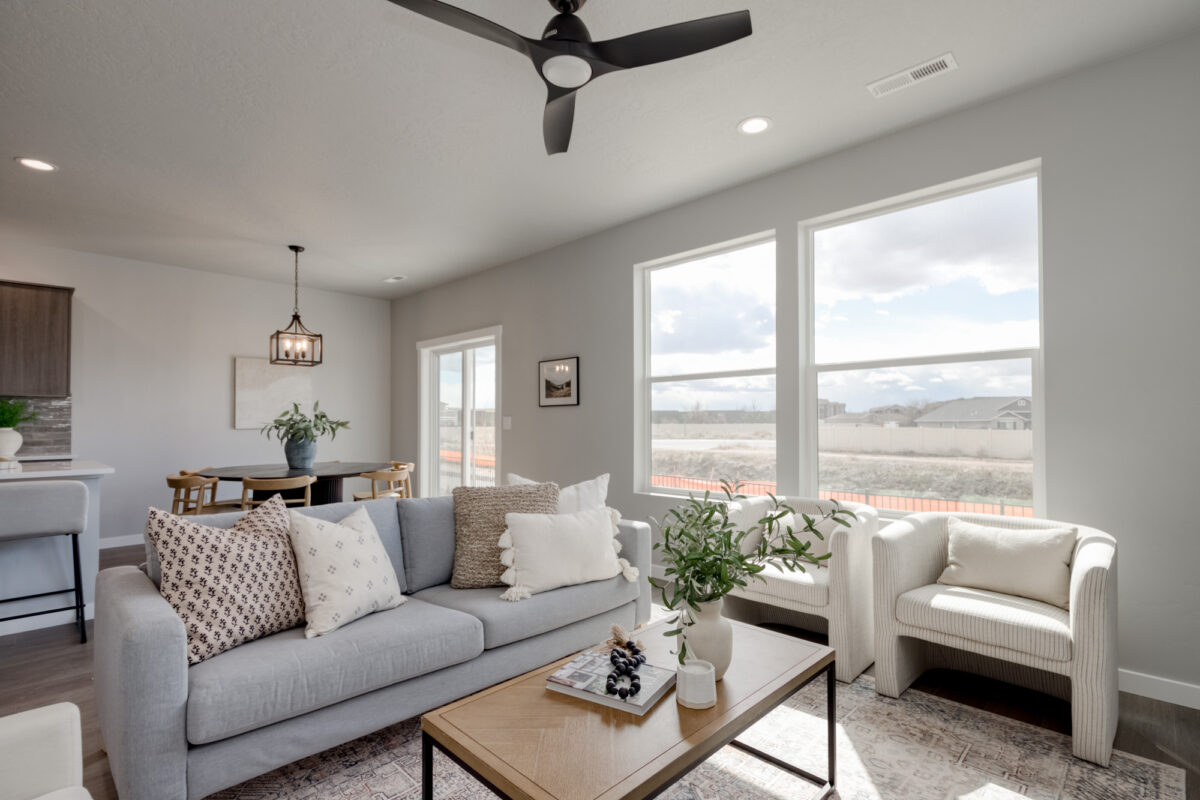 Bright and modern living room inside a new CBH home in Boise, Idaho, featuring stylish finishes, natural light, and comfortable design—showcasing why CBH Homes is the top choice for affordable, quality new homes in Boise.